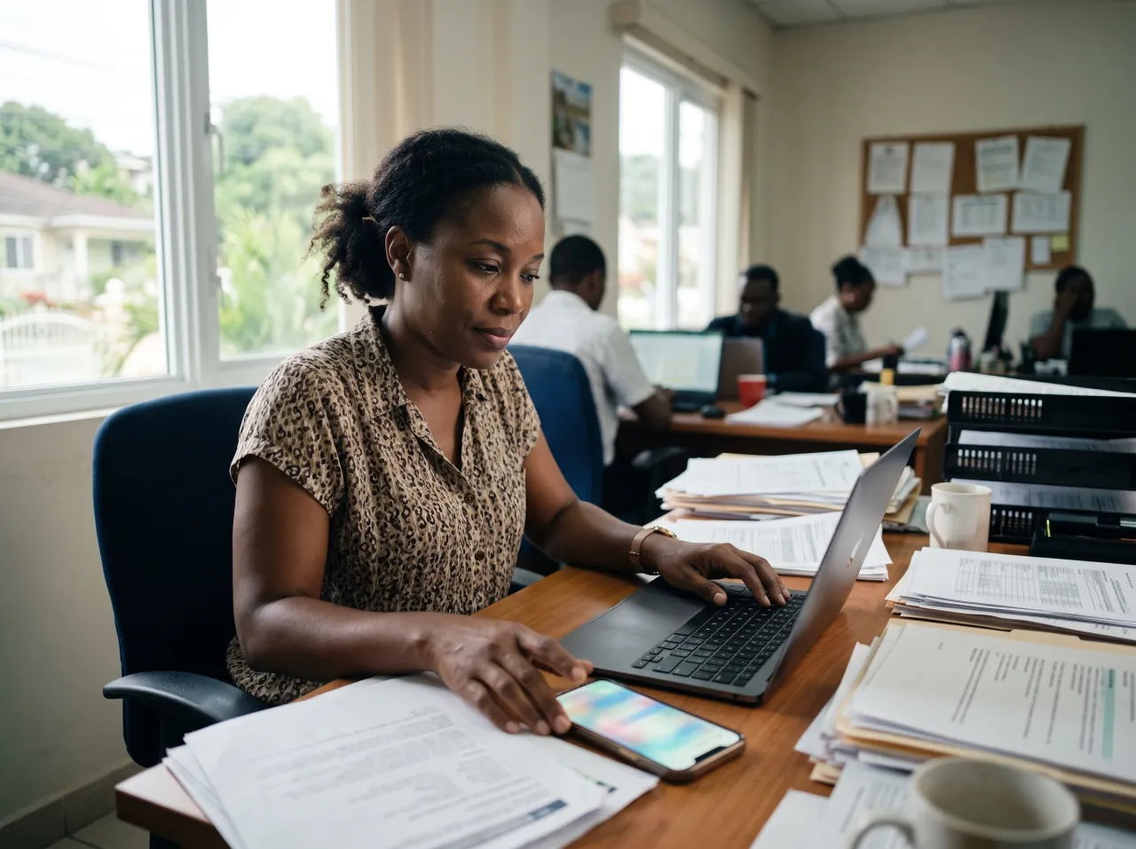 Manager sorting through paper reports and chat messages to find an update